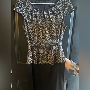 Black and brown dress with a belt.